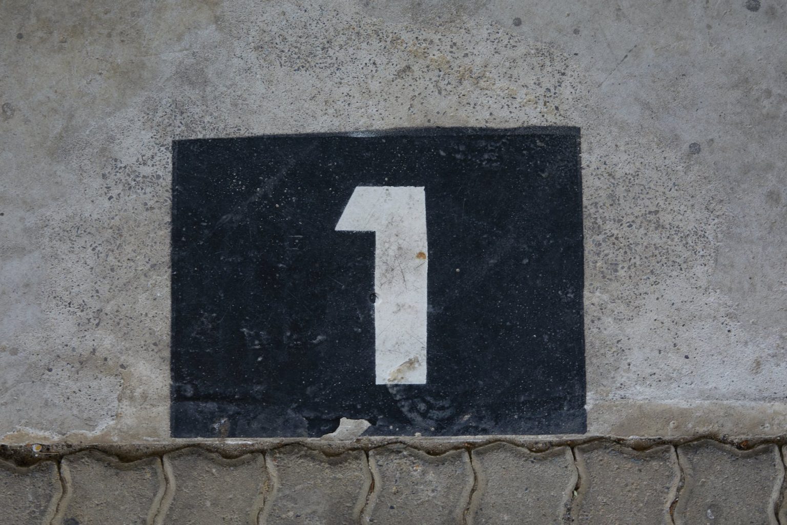 sign with house number on wall